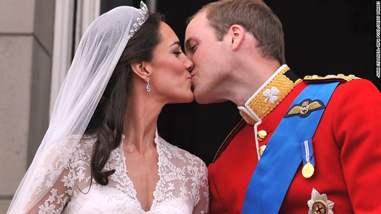 William and Catherine kiss on the balcony of Buckingham Palace after their wedding ceremony in London in 2011.