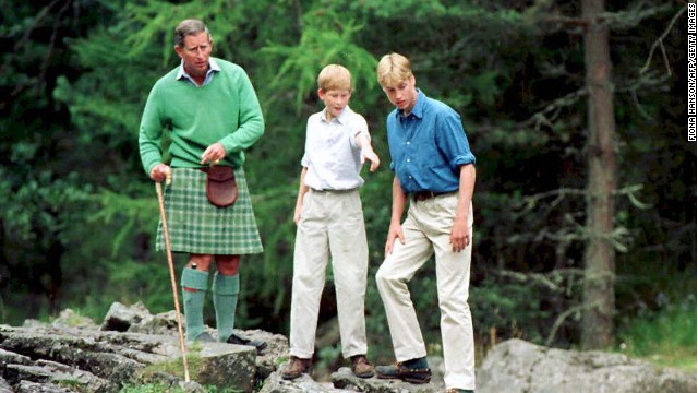 The Prince of Wales, left, and his sons Prince William, right, and Prince Harry stand above the Falls of Muick at Balmoral in 1997.