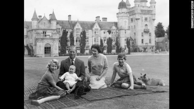 In this September 1960 photo, Queen Elizabeth II and Prince Philip, Duke of Edinburgh pose on the lawn at Balmoral with their children, Prince Andrew, center, Princess Anne, left, and Charles, Prince of Wales.