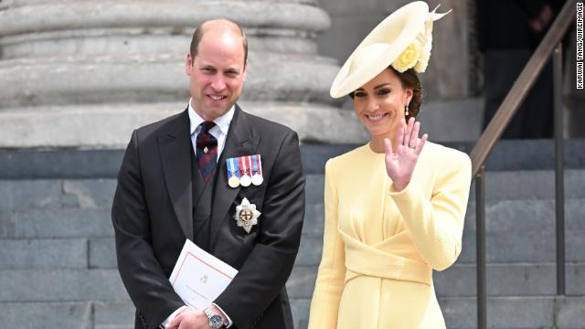 Catherine, Duchess of Cambridge wore a buttery yellow ensemble, with a tea-length dress paired with a twisted waist detail and pearl drop earrings.