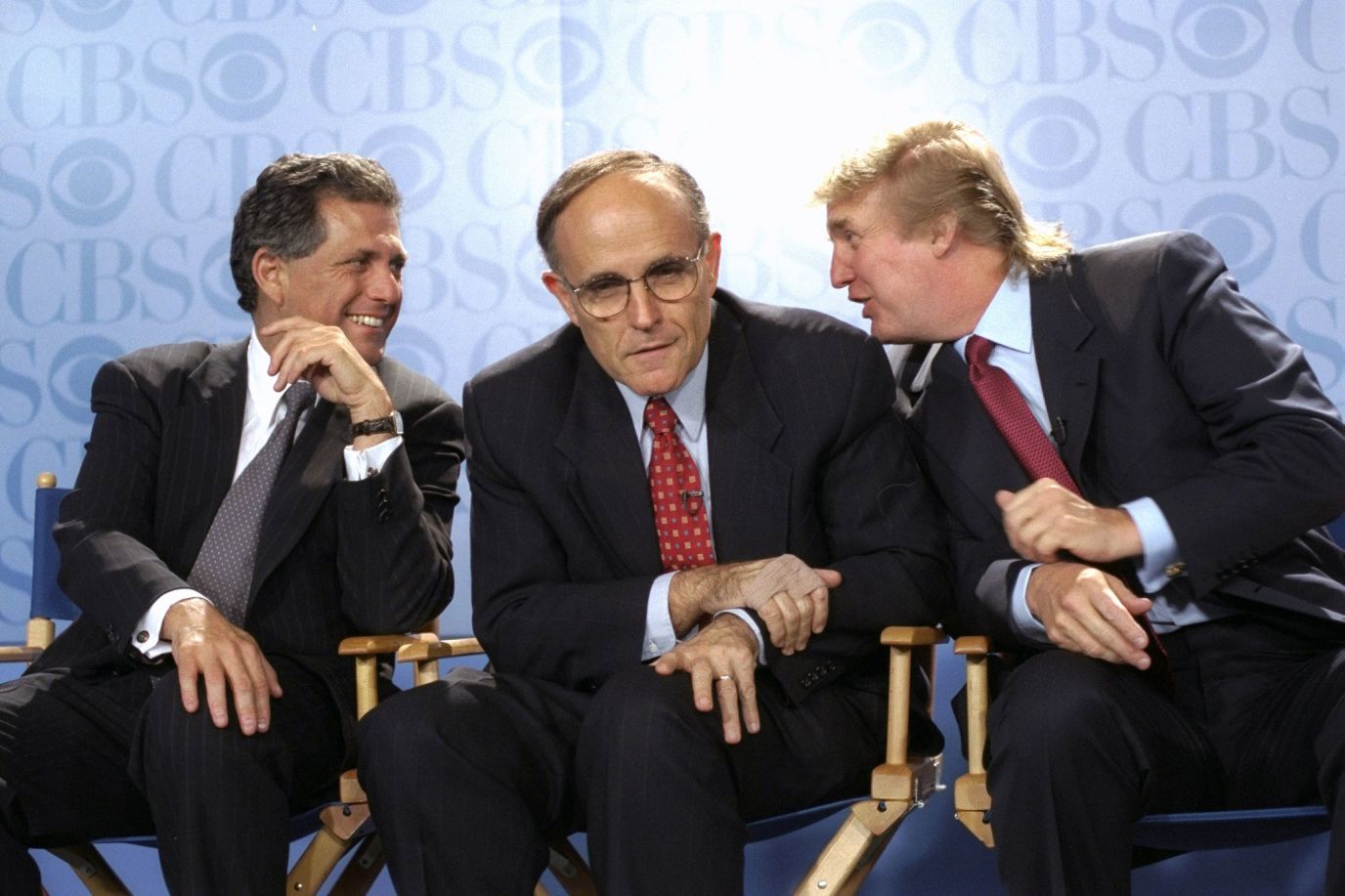 Giuliani pictured with Donald Trump and CBS President Les Moonves at news convention in 1999.