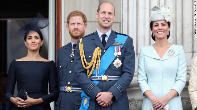 (L-R) Meghan, Prince Harry, Prince William, and Catherine watch an RAF flypast on the balcony of Buckingham Palace on July 10, 2018 in London, England. 