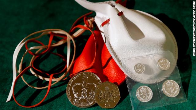 Examples of the two purses on display showing the coins the Queen distributed during the Maundy service in 2013 in Oxford, England.