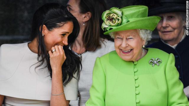 The Queen and Meghan sharing a laugh at an event in 2018.