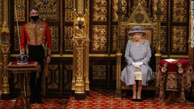 Britain's Queen Elizabeth II sits on the Sovereign's Throne in the House of Lords chamber during the State Opening of Parliament at the Houses of Parliament in London on May 11, 2021.