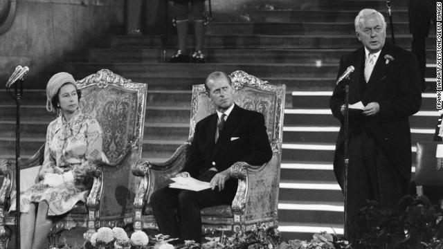 The Queen and the Duke of Edinburgh listen to the Prime Minister Harold Wilson in 1975. 