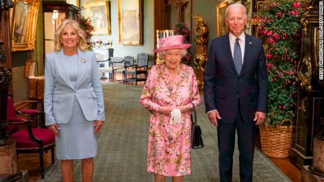 The Queen, US President Biden and first lady Jill Biden pose for photos in the Grand Corridor during their visit to Windsor Castle on June 13. 