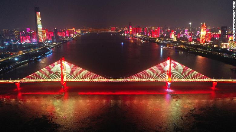 A bridge on China's Yangtze River is lit up during a light show in the city of Wuhan to celebrate the Party's approaching centenary