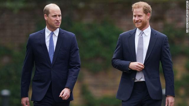 Prince William, left, and Prince Harry, right, arrive for the unveiling of a statue of their mother, Princess Diana at The Sunken Garden in Kensington Palace.