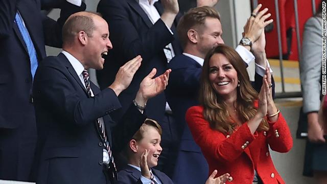 Prince William, his wife Kate and son George watch England play Germany at Wembley stadium in London.