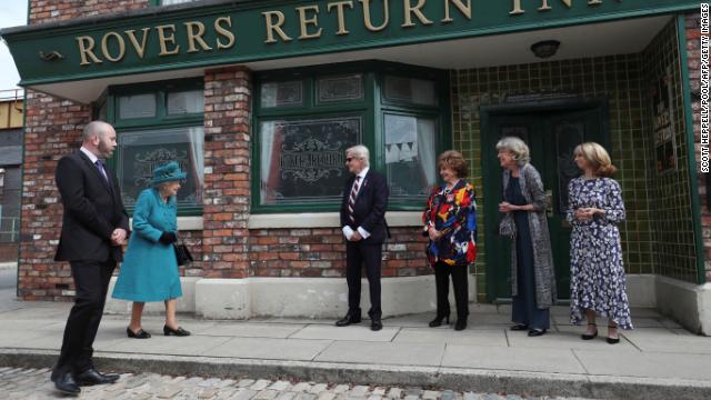 Queen Elizabeth II visited the set of the world’s long-running television soap opera “Coronation Street” in Manchester on Thursday.