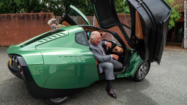 Prince Charles takes a hydrogen-powered car for a spin while visiting Riversimple, an eco-vehicle firm in Wales.