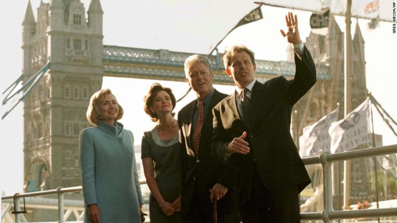 US President Bill Clinton and his wife Hillary pose in front of London's Tower Bridge with British Prime Minister Tony Blair his wife Cherie, center left, on May 29, 1997 before dining in a nearby restaurant.