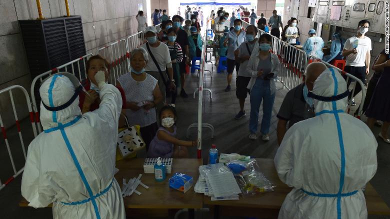 Citizens line up for Covid-19 nucleic acid test at a testing site in Nanjing, China, on August 2.