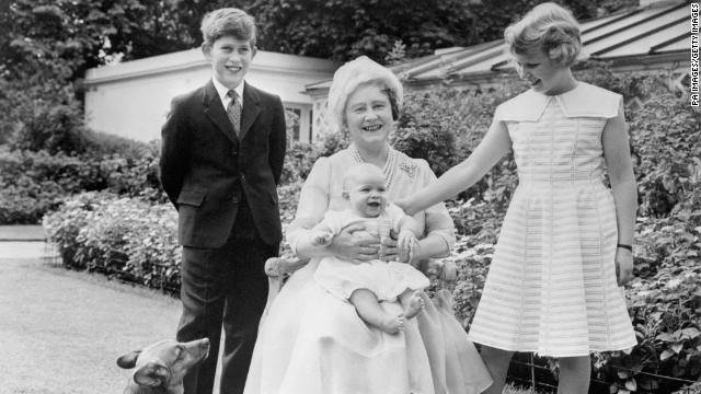 The Queen Mother poses with Prince Charles, Princess Anne and Prince Andrew on the grounds of Clarence House in the 1960s.