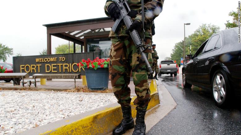 Military Personnel stand guard outside the US Army Medical Research Institute of Infectious Diseases at Fort Detrick on September 26, 2002.