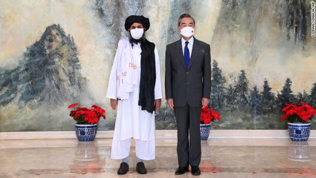 Taliban co-founder Mullah Abdul Ghani Baradar and Chinese Foreign Minister Wang Yi pose for a photo during their meeting on July 28, 2021. 