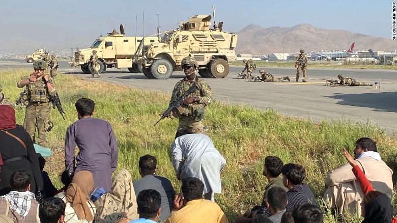 US soldiers stand guard along a perimeter at the international airport in Kabul, Afghanistan, on August 16.