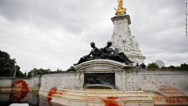 Red stains are seen on the Victorial Memorial outside Buckingham Palace Thursday after climate activists linked to Extinction Rebellion conducted a protest action as part of the group's 'Impossible Rebellion' series of actions. 