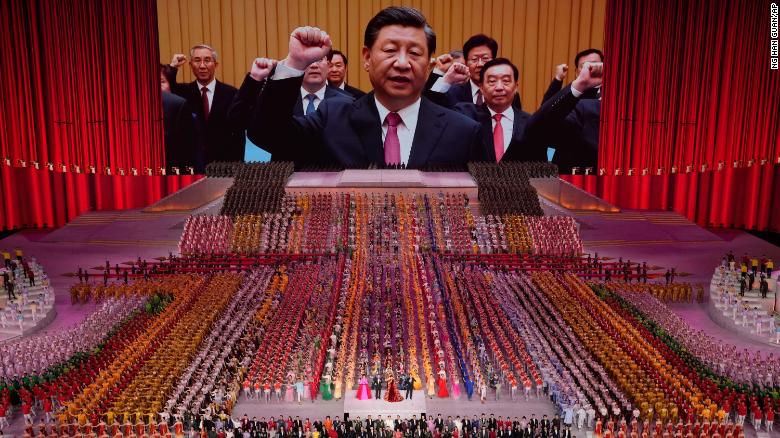 Chinese President Xi Jinping is seen leading other top officials pledging their vows to the party on screen during a gala show ahead of the 100th anniversary of the founding of the Chinese Communist Party in Beijing.