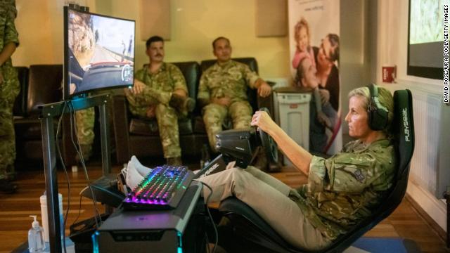 Sophie, the wife of Prince Edward, has a go at rally driving on computer game “Colin McRae: Dirt 2” during an E-Gaming Challenge while visiting RAF Wittering on September 7, 2021 in Peterborough, England. 