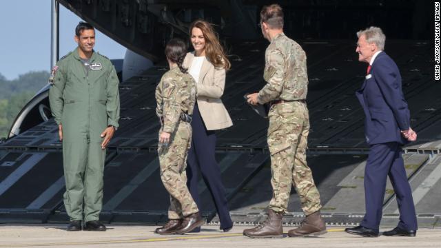 Catherine, Duchess of Cambridge, walks into the fuselage of an RAF C17 Globemaster as she meets individuals who supported the UK's evacuation of civilians from Afghanistan at RAF Brize Norton in England on Wednesday. 