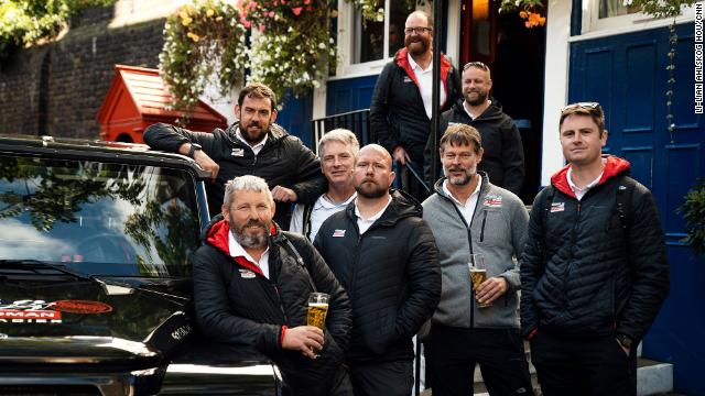 The expedition team share a pint of beer after completing the fundraising trek.