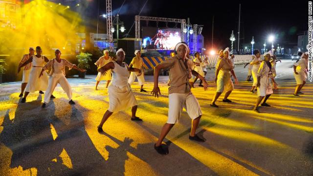 Ahead of the inauguration ceremony, dancers perform before a stage erected in National Heroes Square in Bridgetown.