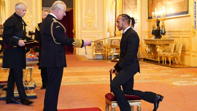 Lewis Hamilton is made a Knight Bachelor by Britain's Prince Charles.