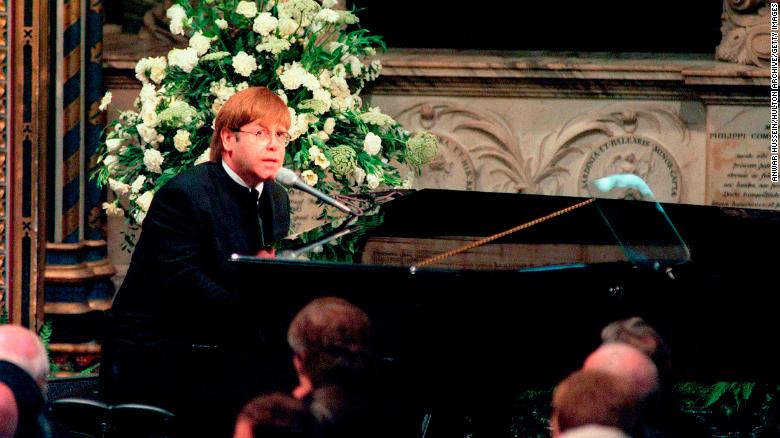 Elton John pictured singing at the funeral of Princess Diana on September 6, 1997.