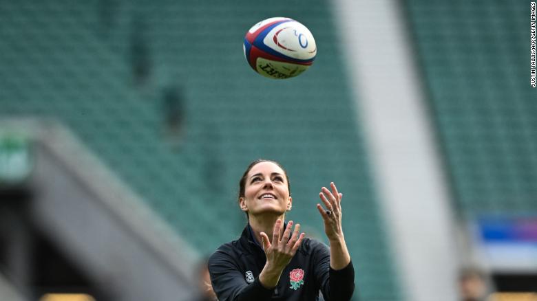 The Duchess of Cambridge plays with a rugby ball as she attends England's rugby teams' training sessions at the Twickenham Stadium in London on February 2, 2022.