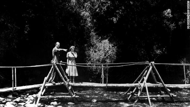 The couple take a walk in the grounds of Sagana Lodge, their wedding present from the people of Kenya, 5th February 1952. The following day, news would arrive of the death of King George VI.