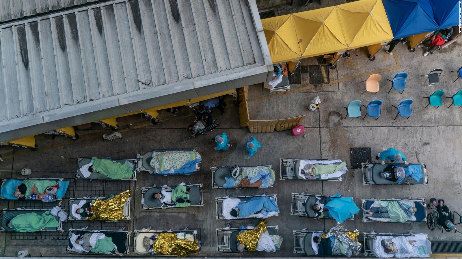 Covid-19 patients wait at a temporary holding area outside Caritas Medical Centre in Hong Kong on February 15.