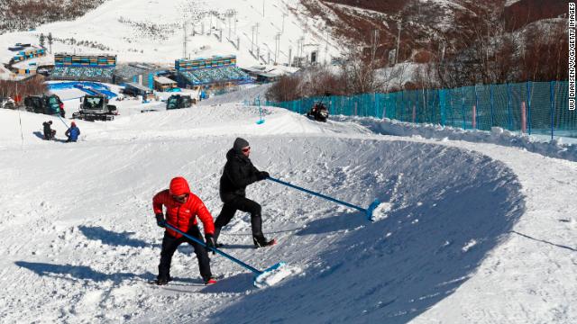 Workers prepare the grounds at Genting Snow Park in China's Zhangjiakou on February 23, ahead of the Paralympic Games.