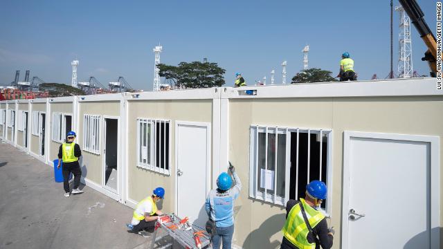 Construction workers at the site of a planned mobile hospital in Hong Kong on February 26.