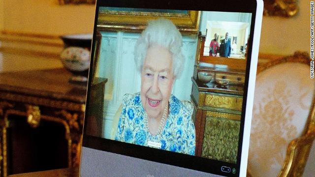 The Queen appears on a screen via videolink from Windsor Castle, during a virtual audience to receive the High Commissioner of Malawi, Dr. Thomas Bisika (not pictured), at Buckingham Palace in London on Thursday.