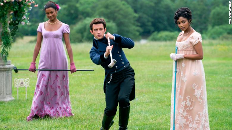 Simone Ashley, Jonathan Bailey and Charithra Chandran are shown in ''Bridgerton.''