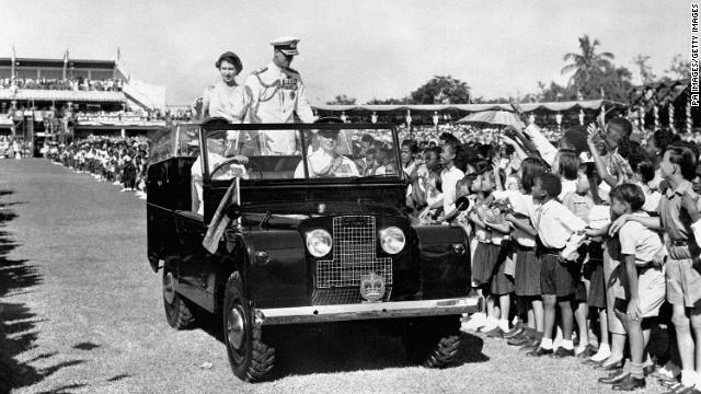 The Queen and Duke of Edinburgh drive past adoring youngsters in Sabina Park, Kingston, during their visit to Jamaica in 1953. 