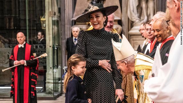 The Duchess of Cambridge reacts as she introduces her daughter, Princess Charlotte, to the Archbishop of Canterbury ahead of the service.