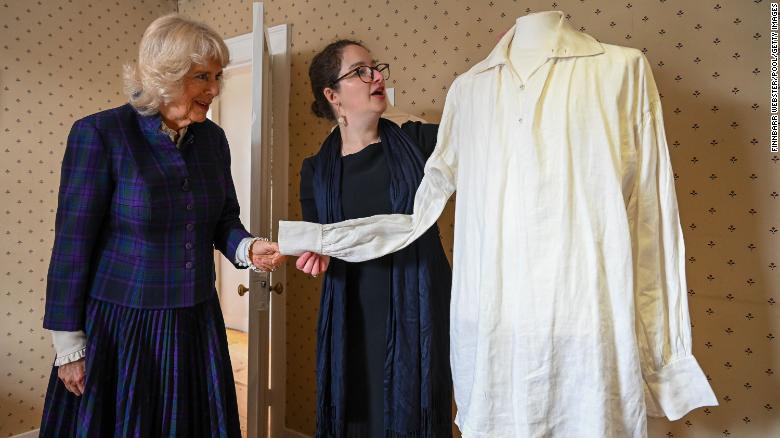 Camilla is shown the white shirt worn by Colin Firth in the BBC's 1995 adaptation of Pride and Prejudice during a visit to Jane Austen's House, on April 06.