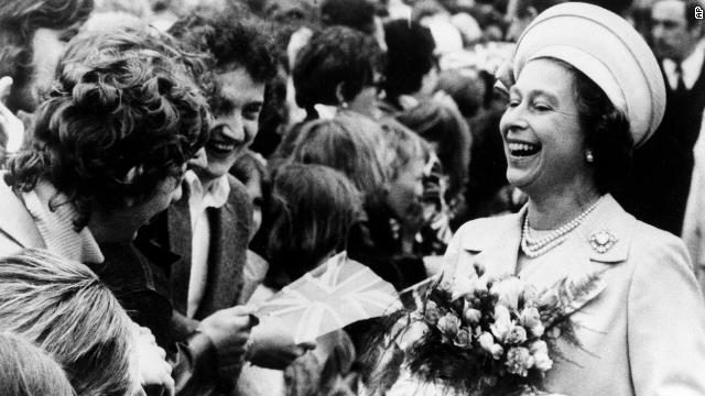 The Queen enjoys a laugh with two young well-wishers at St. Katherine's Dock, London during the final Silver Jubilee event -- a trip down the Thames river on June 9, 1977.