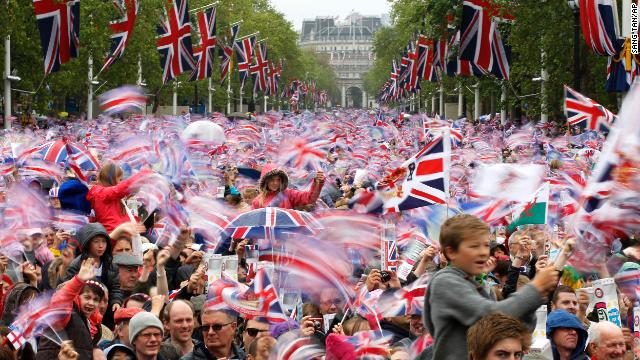 The Mall is awash with red, white and blue as revelers pack in to watch the royal family take to the Buckingham Palace balcony during the Diamond Jubilee weekend in 2012. 