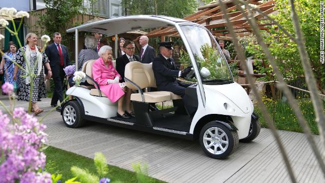 The Queen hit this year's Chelsea Flower Show in style, taking in the designs from the comfort of an electric buggy at London's Royal Hospital Chelsea on Monday. 