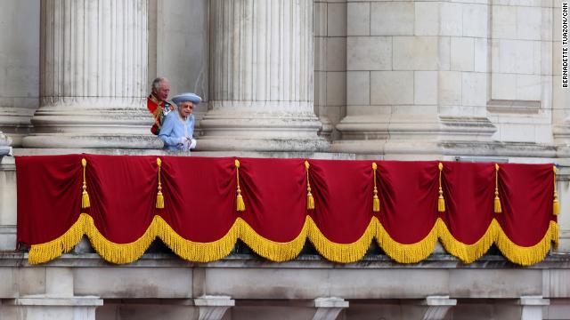 The Queen walks out onto the Buckingham Palace balcony during the Trooping the Colour parade.