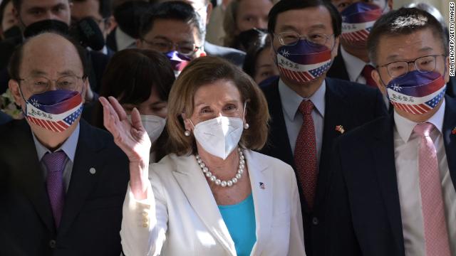 US House Speaker Nancy Pelosi waves to reporters at Parliament in Taipei, Taiwan, on August 3.