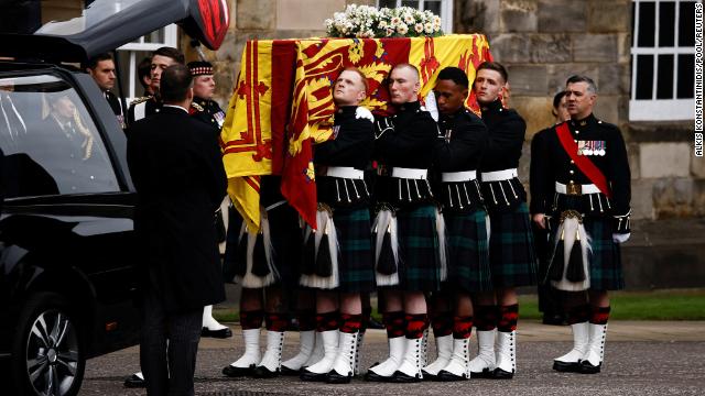 The Queen's coffin arrives at the Palace of Holyroodhouse on Sunday.