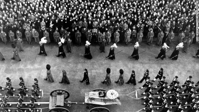 The King's coffin makes its way through the streets of London on its way to Paddington station.