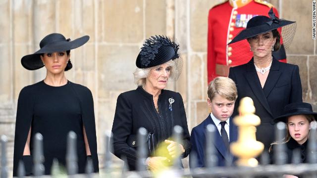 Left to right: The Duchess of Sussex, The Queen Consort, Prince George, The Princess of Wales and Princess Charlotte.