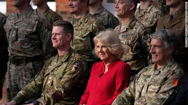 Camilla, Queen Consort poses for a photograph with troops during a visit to the Lille Barracks in Aldershot, southern England on January 31.