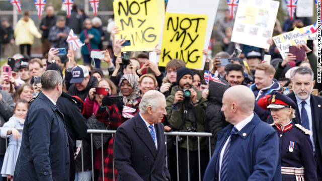 Demonstrators hold placards reading ''Not My King'' as King Charles III meets well-wishers in Milton Keynes, north of London, Thursday. 